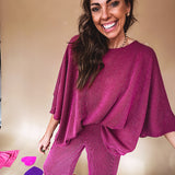 Plum ribbed textured travel set with oversized top with 3/4 sleeves and matching pants with drawstring waist and wide leg.