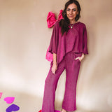 Plum ribbed textured travel set with oversized top with 3/4 sleeves and matching pants with drawstring waist and wide leg.