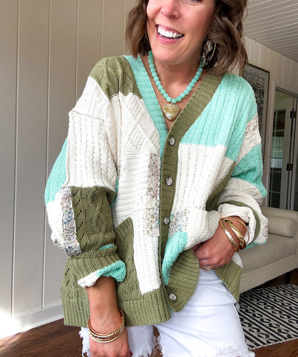 Woven knit button down cardigan with color block patchwork in either mint and green or yellow and taupe.