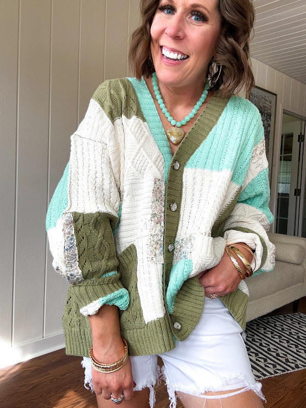 Woven knit button down cardigan with color block patchwork in either mint and green or yellow and taupe.