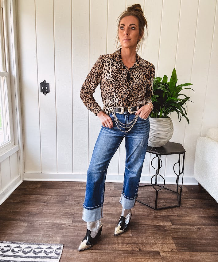 Thin, silky leopard print long blouse/dress with black button front , long sleeves, collar and shimmer detail throughout.