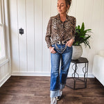 Thin, silky leopard print long blouse/dress with black button front , long sleeves, collar and shimmer detail throughout.