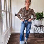 Thin, silky leopard print long blouse/dress with black button front , long sleeves, collar and shimmer detail throughout.