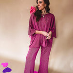 Plum ribbed textured travel set with oversized top with 3/4 sleeves and matching pants with drawstring waist and wide leg.