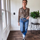 Thin, silky leopard print long blouse/dress with black button front , long sleeves, collar and shimmer detail throughout.