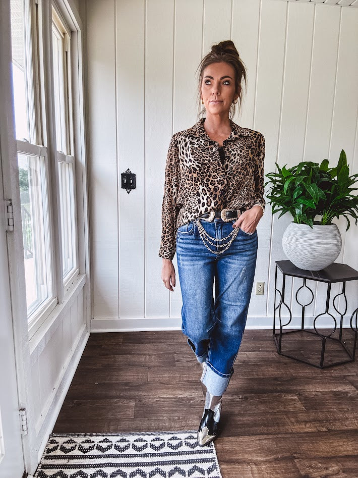Thin, silky leopard print long blouse/dress with black button front , long sleeves, collar and shimmer detail throughout.