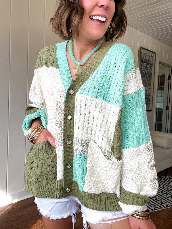 Woven knit button down cardigan with color block patchwork in either mint and green or yellow and taupe.