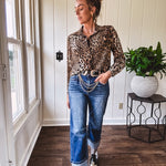 Thin, silky leopard print long blouse/dress with black button front , long sleeves, collar and shimmer detail throughout.