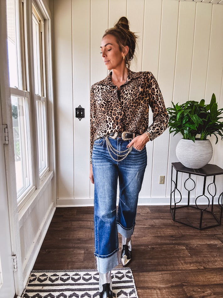 Thin, silky leopard print long blouse/dress with black button front , long sleeves, collar and shimmer detail throughout.