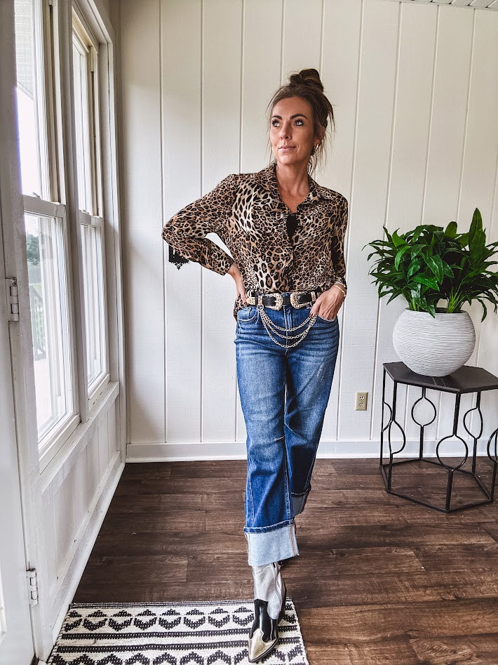 Thin, silky leopard print long blouse/dress with black button front , long sleeves, collar and shimmer detail throughout.