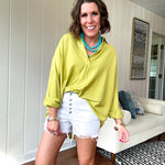 White short inseam raw hem stretchy shorts with button down closure.