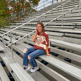 Red brown and cream striped sweatshirt with oversized dolman cut, short sleeves and a gingham football applique trimmed in cream lace.
