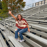 Red brown and cream striped sweatshirt with oversized dolman cut, short sleeves and a gingham football applique trimmed in cream lace.