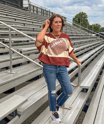 Red brown and cream striped sweatshirt with oversized dolman cut, short sleeves and a gingham football applique trimmed in cream lace.
