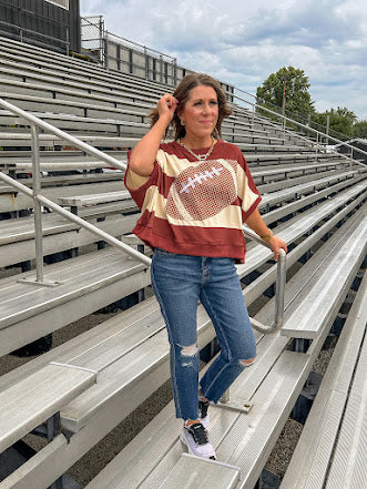 Red brown and cream striped sweatshirt with oversized dolman cut, short sleeves and a gingham football applique trimmed in cream lace.