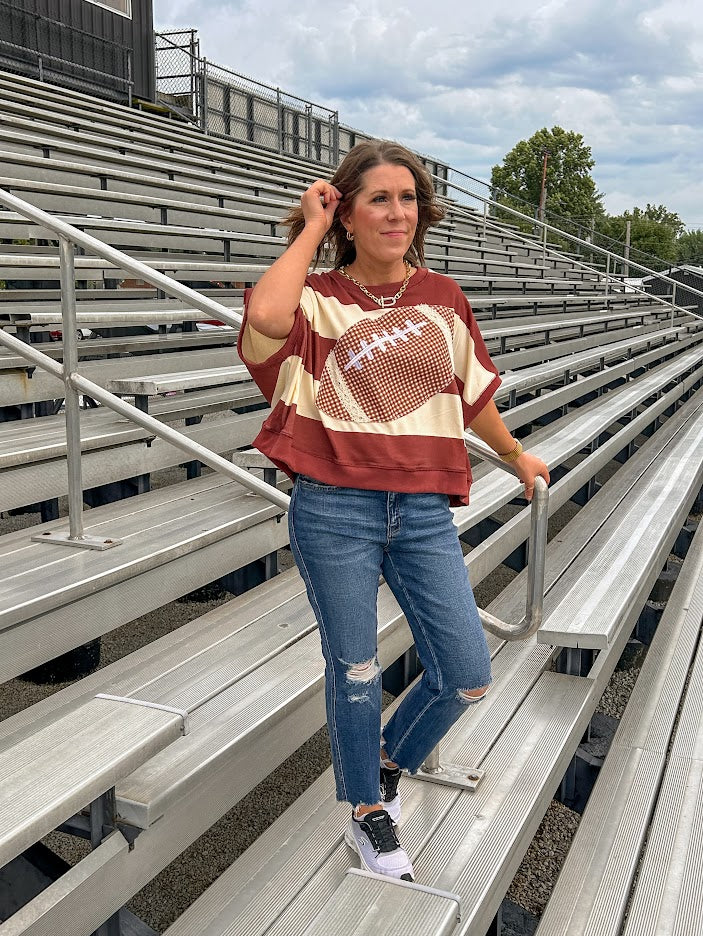 Red brown and cream striped sweatshirt with oversized dolman cut, short sleeves and a gingham football applique trimmed in cream lace.