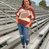Red brown and cream striped sweatshirt with oversized dolman cut, short sleeves and a gingham football applique trimmed in cream lace.