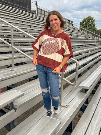 Red brown and cream striped sweatshirt with oversized dolman cut, short sleeves and a gingham football applique trimmed in cream lace.