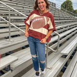 Red brown and cream striped sweatshirt with oversized dolman cut, short sleeves and a gingham football applique trimmed in cream lace.