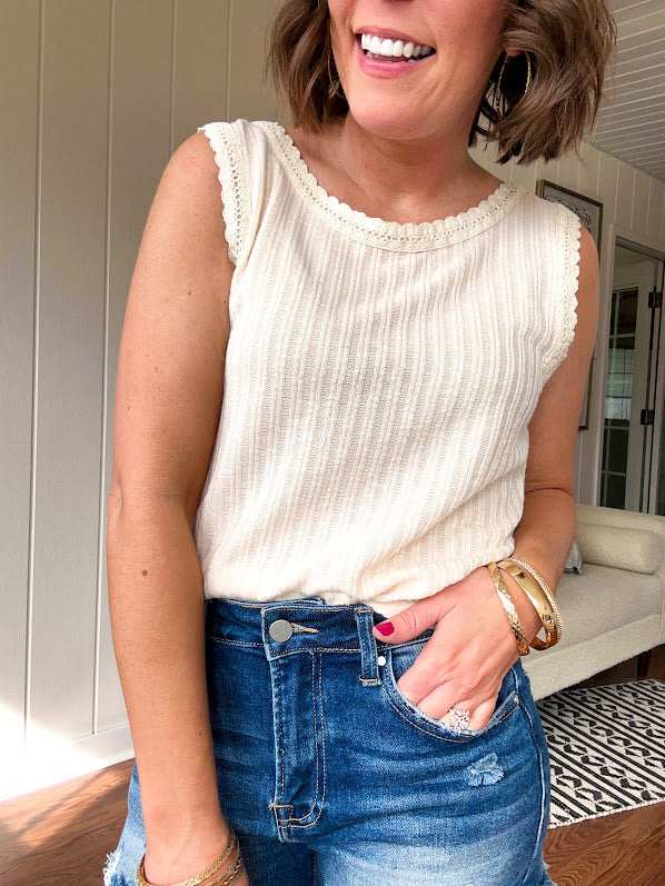 Ribbed textured tank with eyelet crocheted trim. Available in many colors
