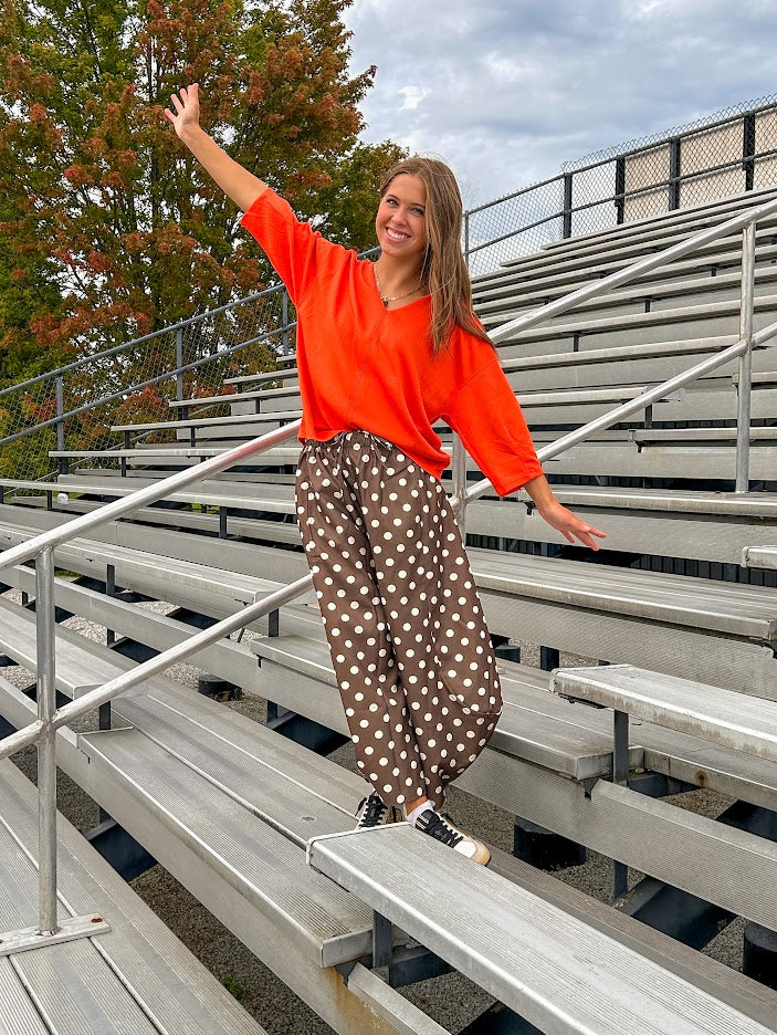 Slick brown with white polka dots balloon style pants with extra volume in the legs and elastic waist.