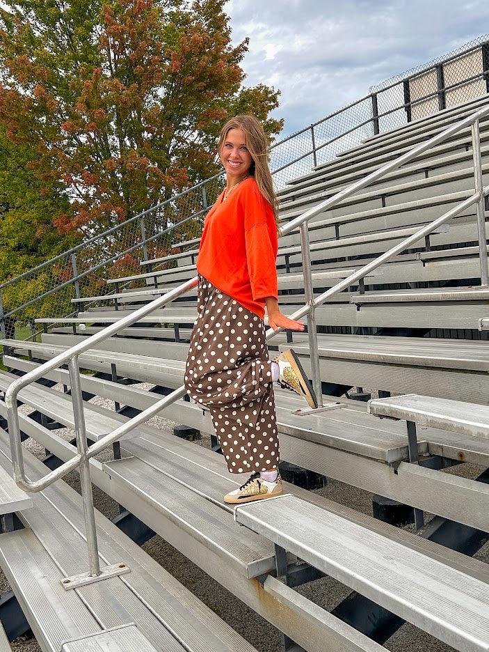 Slick brown with white polka dots balloon style pants with extra volume in the legs and elastic waist.