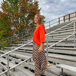Slick brown with white polka dots balloon style pants with extra volume in the legs and elastic waist.