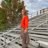 Slick brown with white polka dots balloon style pants with extra volume in the legs and elastic waist.