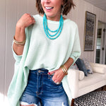 Oversized dolman 3/4 sleeve top with waffle texture.