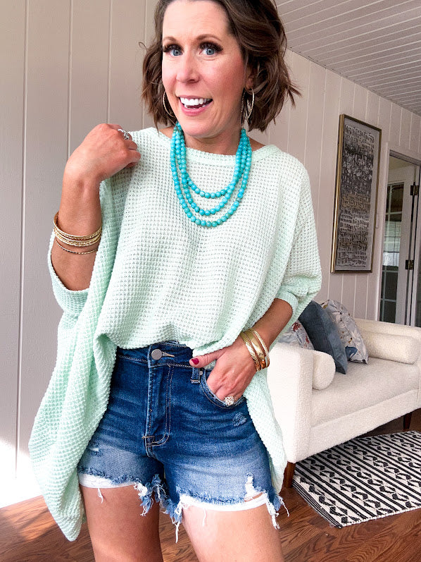 Oversized dolman 3/4 sleeve top with waffle texture.