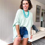 Oversized dolman 3/4 sleeve top with waffle texture.