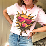 Bubble gum pink cotton tee with large orange sun with a face, pink sunglasses and bubble gum graphic.