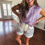 Cable knit metallic cropped sweater vest.