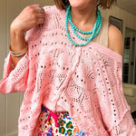 Soft, woven wide V neck sweater with 3/4 sleeves and a seashell design in the weave with exposed seams down the middle and at the shoulders. Oversized