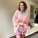 Silky athleisure material shorts with multi colored leopard print, pink drawstring and trim.