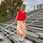 Cool red cotton blend bubble hem blouse tank with padded shoulders with shoulder pleats and round neck.