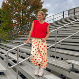 Cool red cotton blend bubble hem blouse tank with padded shoulders with shoulder pleats and round neck.