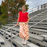 Cool red cotton blend bubble hem blouse tank with padded shoulders with shoulder pleats and round neck.