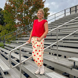 Cool red cotton blend bubble hem blouse tank with padded shoulders with shoulder pleats and round neck.
