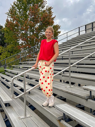 Cool red cotton blend bubble hem blouse tank with padded shoulders with shoulder pleats and round neck.