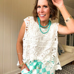 Relaxed fit crochet tank with a sheer, open weave.