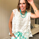 Relaxed fit crochet tank with a sheer, open weave.