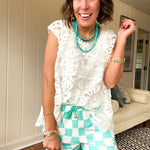 Relaxed fit crochet tank with a sheer, open weave.