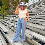 Light wash denim-like wide leg pants with leo and red striping down the sides and elastic, drawstring waist.