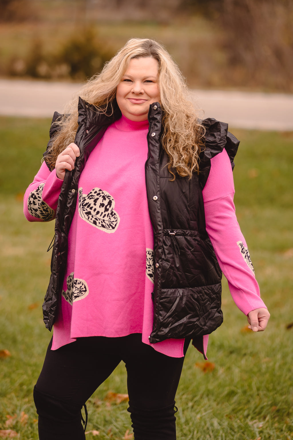 Black Puffer Vest with Shoulder Ruffle Detail