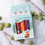 Box of three Naked Bee lip balms including Plum Joy, Jolly Tangerine and Cranberry Frost.