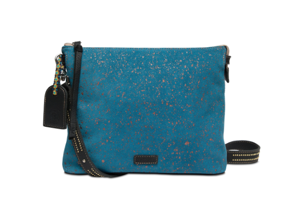 Consuela slate blue suede crossbody with copper flecks, an adjustable strap two inside pockets with a zipper closure, an interior slide pocket, credit card slots, and a removable studded black leather strap