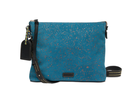 Consuela slate blue suede crossbody with copper flecks, an adjustable strap two inside pockets with a zipper closure, an interior slide pocket, credit card slots, and a removable studded black leather strap