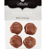 4 pieces of sugar free milk chocolate, caramel and pecan candies.