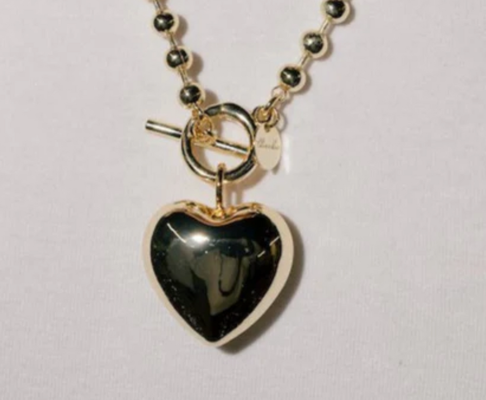 LARGE gold heart pendant.